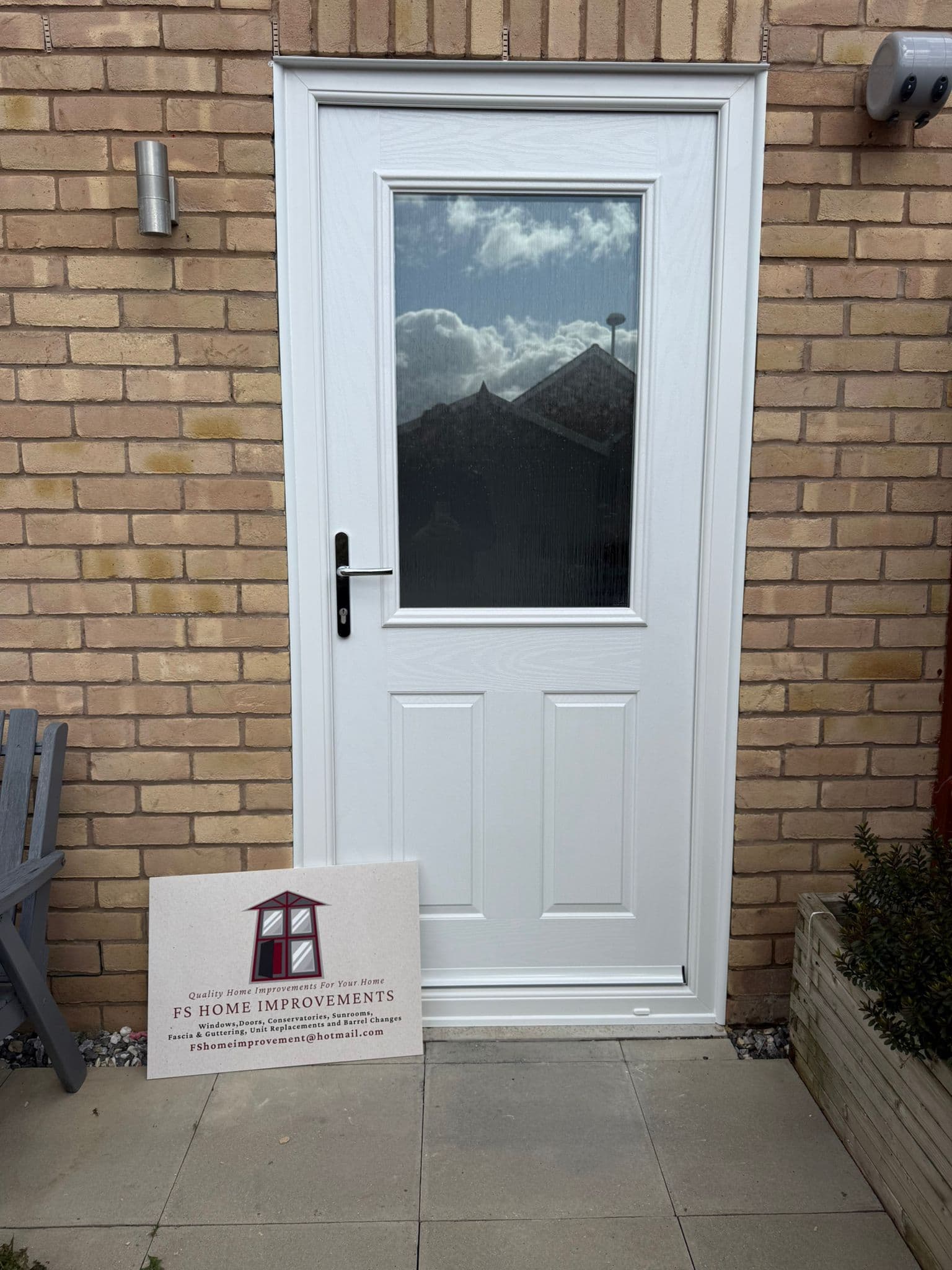 White composite front door with decorative glazing